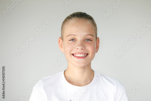 Portrait of a smiling boy with uneven teeth. Dental medicine and healthcare