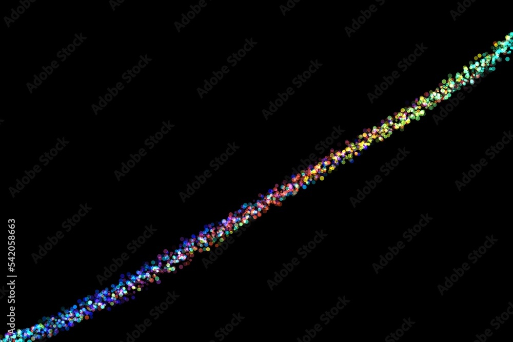 Closeup of a line of shooting confetti paper shoot on a black background Closeup of a line of shooting confetti paper shoot on a black background
