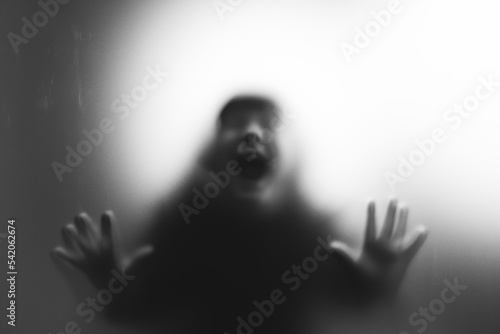Принти на полотні Shadowy figure, child behind glass - horror background