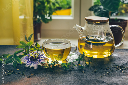 Картината върху платно Herbal tea from the leaves of the passion flower on rustic background