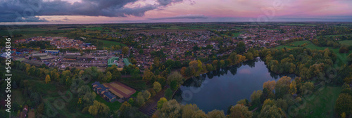 Fotografija An aerial view of the lake at sunrise in Needham Market, Suffolk UK