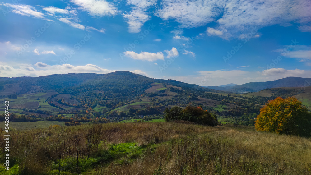 Autumn landscape backgroun in the sunny weather with clouds