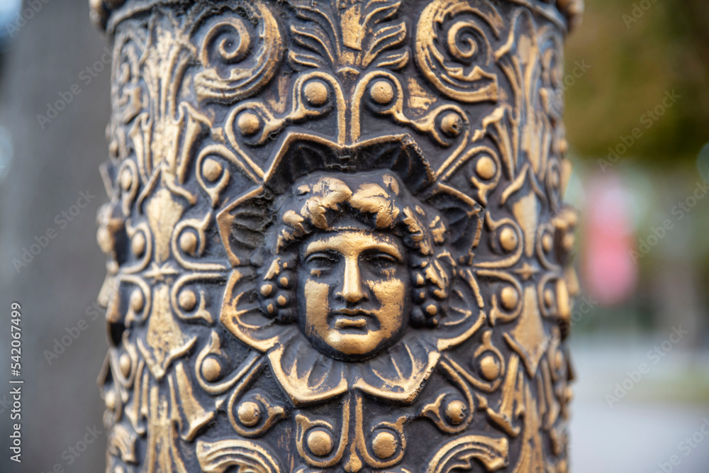 Detail of a street lamp post sculpture in the streets of Paris, France