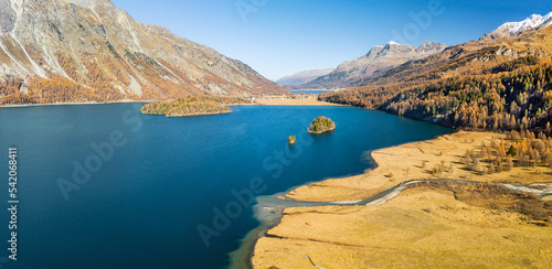 Aerial image of the Chaviolas, Chaste islets and Isolat on the lake of Silsersee in autumn color in St. Moritz, Switzerland