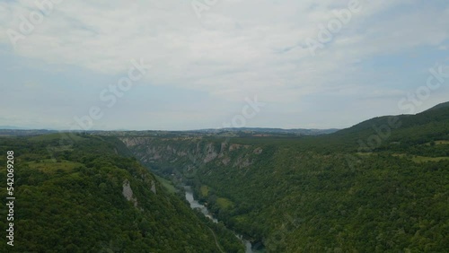 River in a valley surrounding by forest