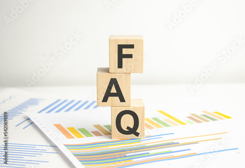 FAQ Wooden blocks text and charts on white background