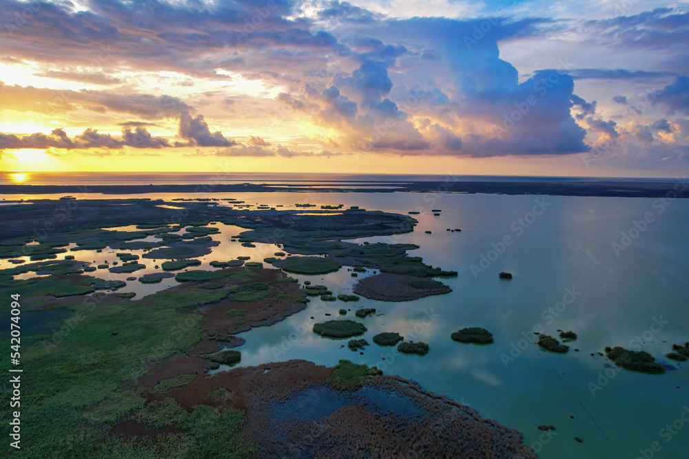 Awesome view of small islets formed in wetland in Göksu delta at sunrise, magnificent sunrise view, clouds, sea and small islets
