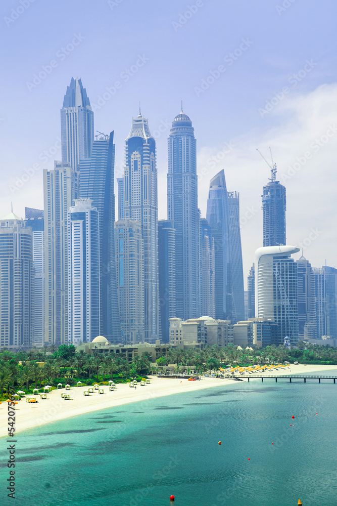 Obraz premium Dubai Marina skyscrapers, complex of residential and office buildings with beautiful white sand beaches. Dubai, UAE
