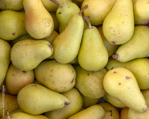 Closeup of fresh ripe Pears for sale at a food market  