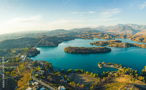 Green Canyon nature reserve in Turkey. Drone view of the magnificent Green lake Manavgat surrounded by mountain cliffs, flat landscape with buildings and roads. High quality photo