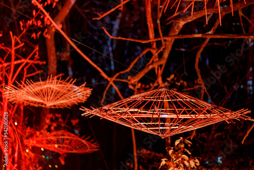 wicker baskets hanging from trees at a haunted forest during halloween