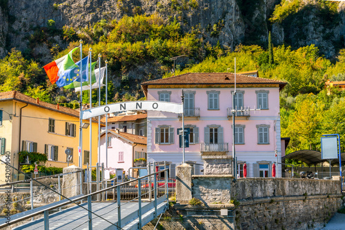 Fototapeta Naklejka Na Ścianę i Meble -  The ferry dock at the lakefront village of Onno, Italy, in the municipality of Oliveto Lario and province of Lecco on the shores of Lake Como. 