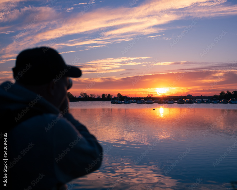 silhouette of photographer photographing sunset