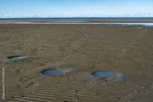 Low tide at Sandgate with Stingray craters. photo