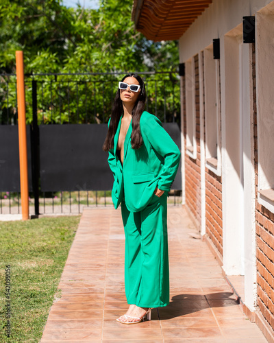portrait of a woman in a green business suit