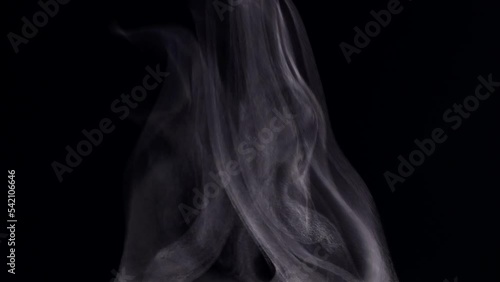 Extreme close up white steam smoke vapor rising up from hot coffee cup, realistic nature steam smoke, mist on black background, 4K. Concept of steam, smoke, vapor, mist, fog