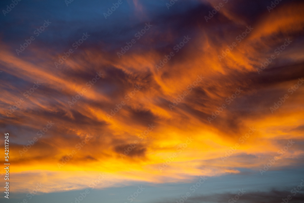 Colorful clouds light up sky at sunset