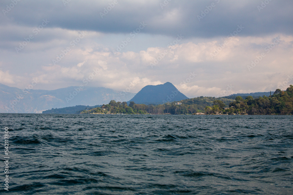 Lake Atitlan view of forest community and mountains, Guatemala.