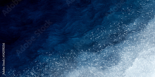 Abstract blue paint background with white splatter like snow grunge texture vintage style in concept winter, ocean, sky.