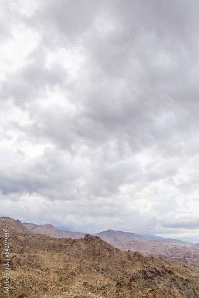 Cloudy sky over rocky mountains