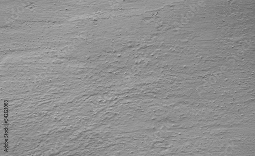 Close-up fragment of a wall with light gray plaster.