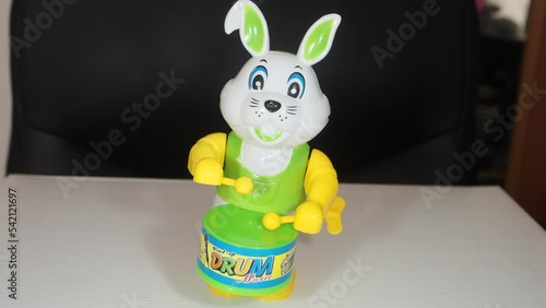 toy rabbit drummer symbol amulet of the new year according to the eastern calendar on a black background
