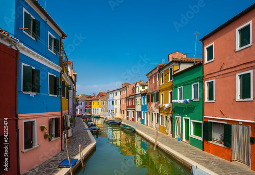 Colorful facades on a street at Burano island in Venice, Italy