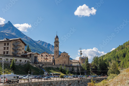 View of the Stone Bell Tower of the Church of Cogne in Aosta - Italy photo