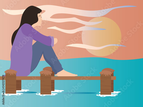 Lonely woman sitting alone on the jetty at beach