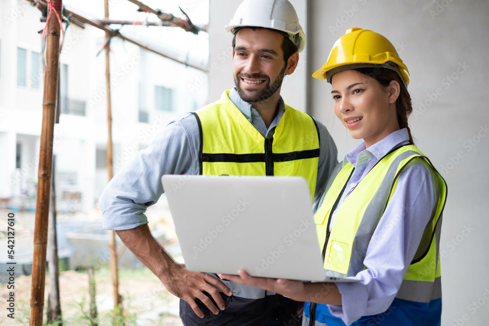 Engineers on building site. Engineer are working contruction on site plans to build high-rise buildings building. Architect caucasian man working with colleagues mixed race in the construction site. Engineers on building site. Engineer are working contruction on site plans to build high-rise buildings building. Architect caucasian man working with colleagues mixed race in the construction site.