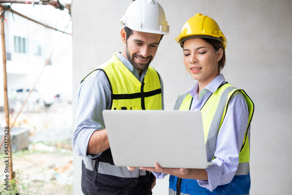 Engineers on building site. Engineer are working contruction on site plans to build high-rise buildings building. Architect caucasian man working with colleagues mixed race in the construction site. Engineers on building site. Engineer are working contruction on site plans to build high-rise buildings building. Architect caucasian man working with colleagues mixed race in the construction site.