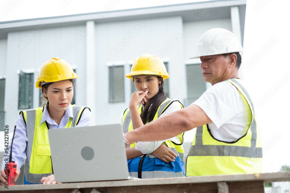 Engineers on building site. Engineer are working contruction on site plans to build high-rise buildings building. Architect caucasian man working with colleagues mixed race in the construction site. Engineers on building site. Engineer are working contruction on site plans to build high-rise buildings building. Architect caucasian man working with colleagues mixed race in the construction site.