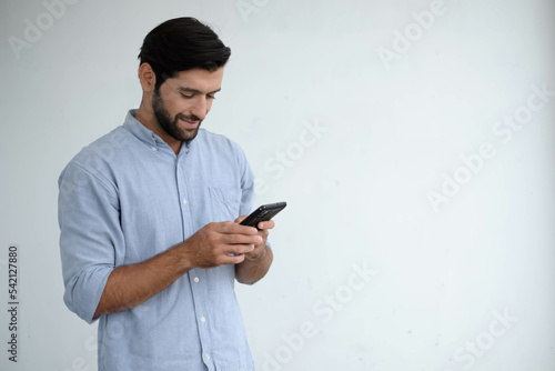 Happy engineering using mobile phone. caucasian man with smart phone. Young businessman on the way to the office searching information on the internet with smartphone. Business, lifestyle concept.