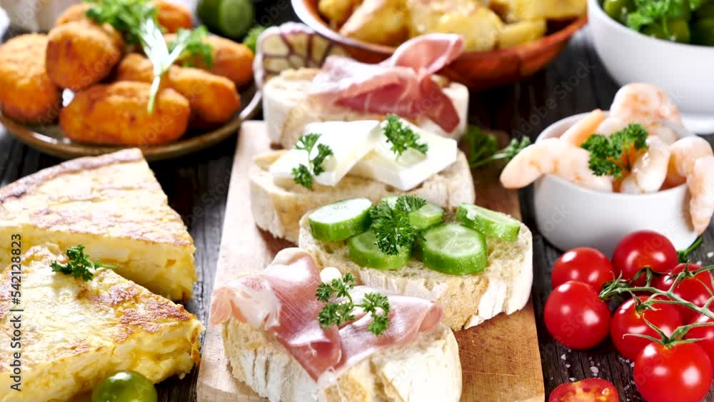 assorted of tapas on wooden board assorted of tapas on wooden board