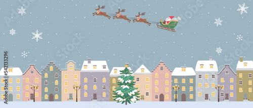 クリスマス背景イラスト　そりに乗ったサンタクロース　 ヨーロッパの街並み