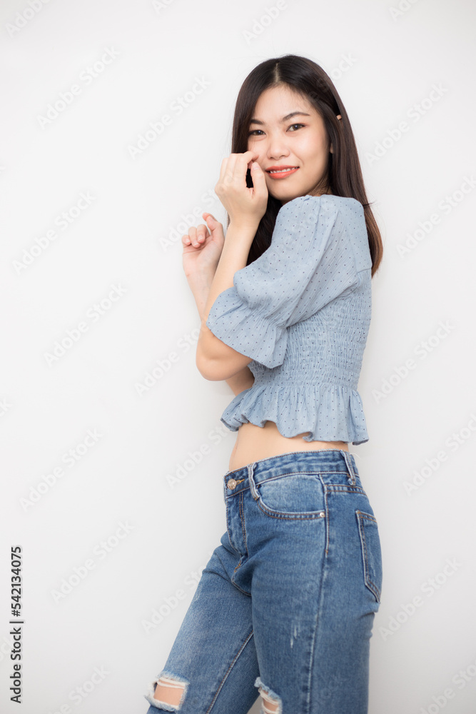 Beautiful asian woman wear jean smiling on white background Beautiful asian woman wear jean smiling on white background