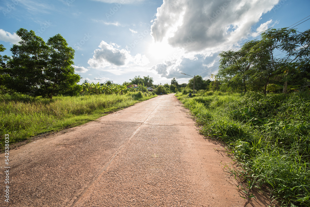 road with deep sun and clouds in the province of udon thani in thailand.