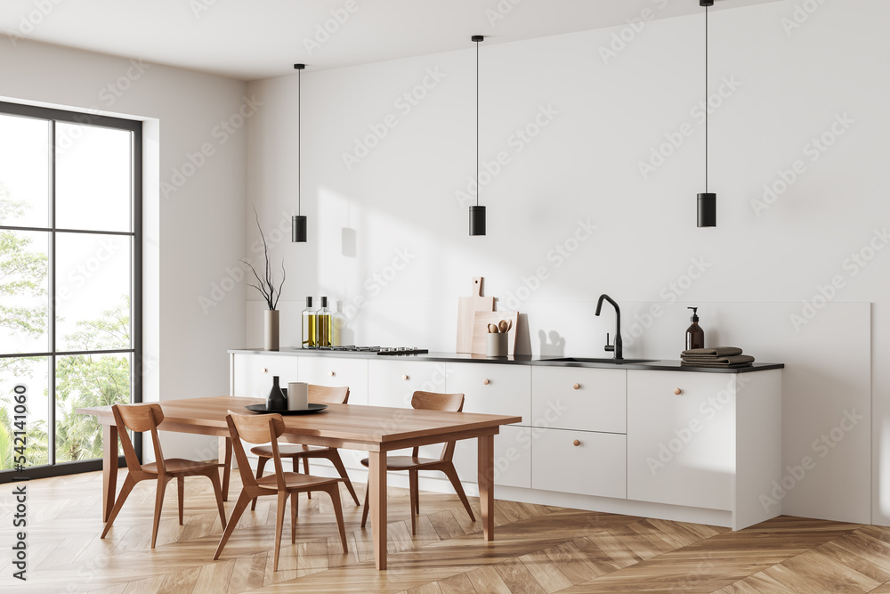 Light kitchen interior with dining and cooking space, window and kitchenware Light kitchen interior with dining and cooking space, window and kitchenware