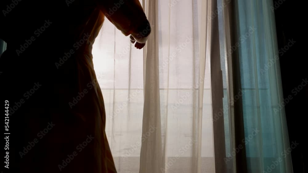Beautiful forty years old woman opening the curtains and walking to outdoor balcony with sea beach and ocean view for leisure travel and vacation. Beautiful forty years old woman opening the curtains and walking to outdoor balcony with sea beach and ocean view for leisure travel and vacation.