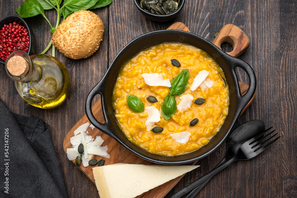 Butternut soup o risotto with pumpkin seeds, with basil and olive oil. seasonal fall menu Butternut soup o risotto with pumpkin seeds, with basil and olive oil. seasonal fall menu