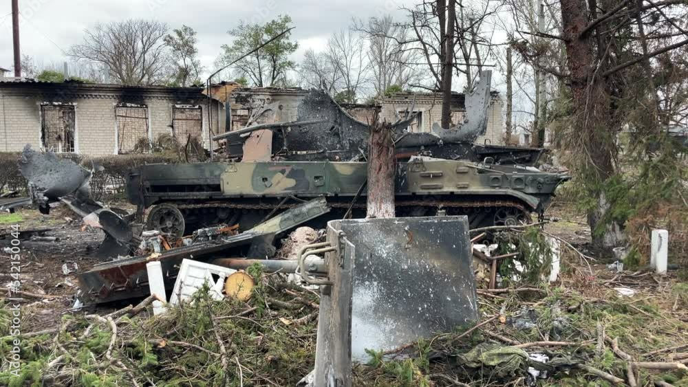 Destroyed and burnt-out tank of the Russian army as a result of the battle with Ukrainian troops in the forest near. Russian aggression in Ukraine. Destroyed and burnt-out tank of the Russian army as a result of the battle with Ukrainian troops in the forest near. Russian aggression in Ukraine.