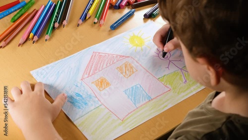 child draws house
