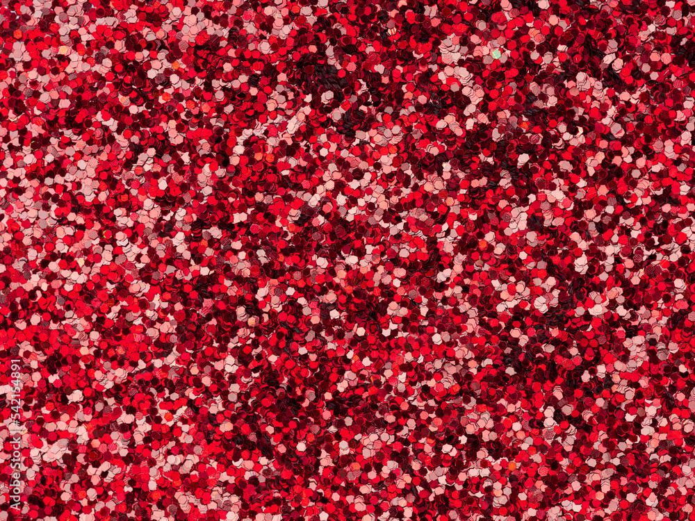 Red glitter texture closeup. Saturated shiny holographic background for Christmas desktop, holiday New Year, xmas seasonal decoration, valentin day, party greeting and wedding invitation card element. Red glitter texture closeup. Saturated shiny holographic background for Christmas desktop, holiday New Year, xmas seasonal decoration, valentin day, party greeting and wedding invitation card element.