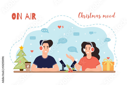 Christmas mood. A man and a woman in headphones talking on air. Broadcast concept.