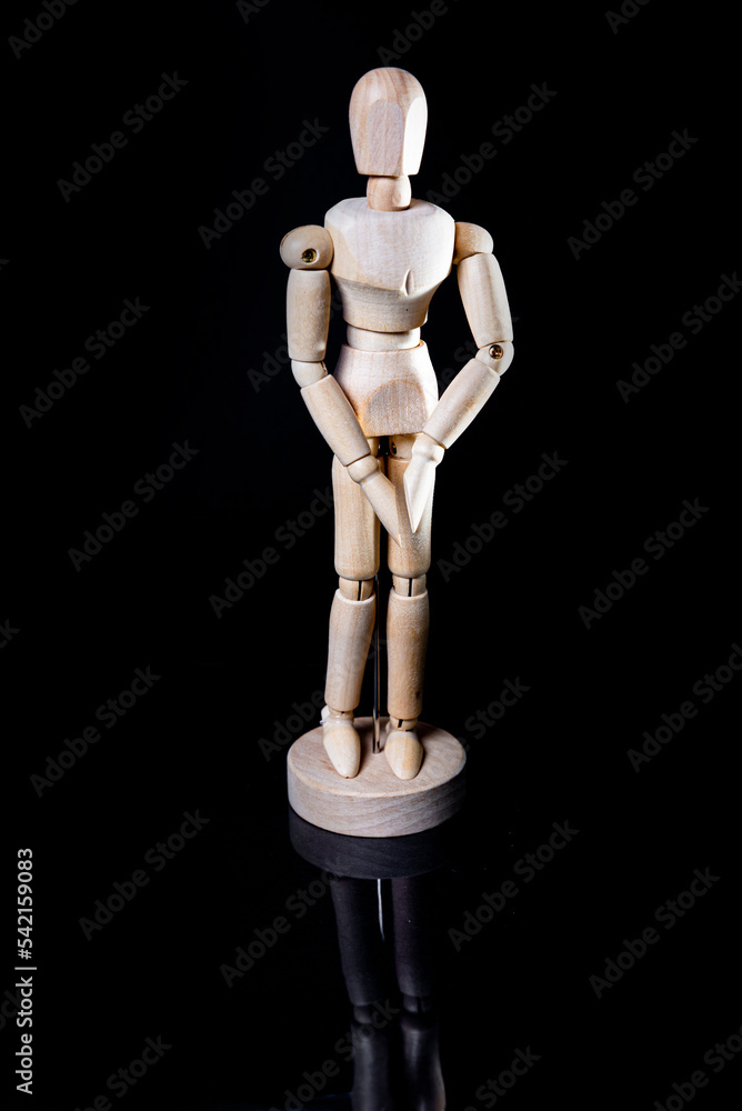 Image of wooden manikin on black background poses different posing Image of wooden manikin on black background poses different posing