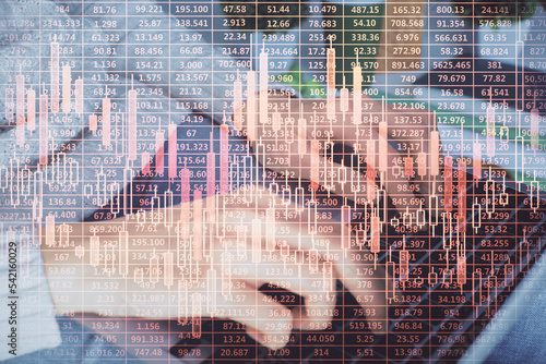 Double exposure of woman hands typing on computer and forex chart hologram drawing. Stock market invest concept.