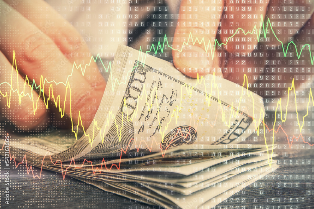 Multi exposure of forex graph drawing hologram and USA dollars bills and man hands. Technical Analysis concept. Multi exposure of forex graph drawing hologram and USA dollars bills and man hands. Technical Analysis concept.