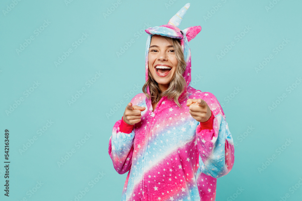 Young woman 20s wear domestic costume with hoody and animals ears point index finger camera on you motivating encourage isolated on plain pastel light blue cyan background. People lifestyle concept. Young woman 20s wear domestic costume with hoody and animals ears point index finger camera on you motivating encourage isolated on plain pastel light blue cyan background. People lifestyle concept.