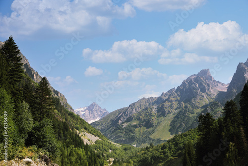 Picturesque view of trees and mountains under light blue sky outdoors, space for text