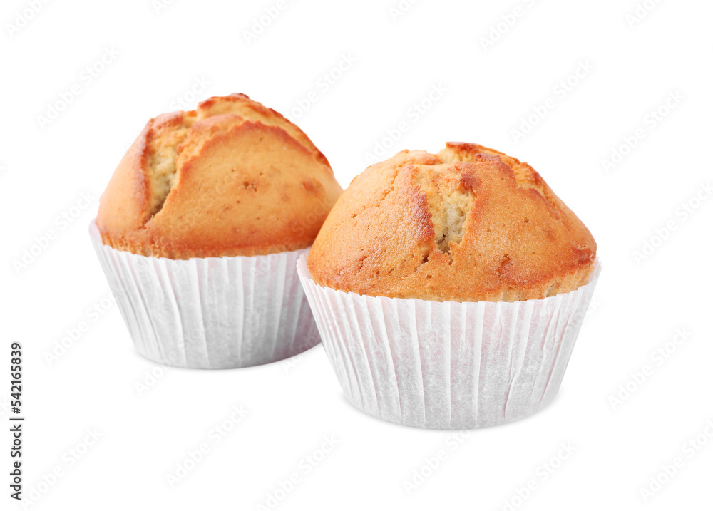 Tasty muffins in paper cups on white background Tasty muffins in paper cups on white background